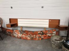 A 1970s teak bed headboard