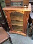 A pine display cabinet / book case with glazed door