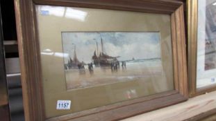 A mid 19th century oil on board/panel coastal scene with sailing boats on beach signed H Walter (