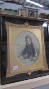 A Victorian portrait photograph of a lady in ornate gilt frame within a velvet lined and glazed