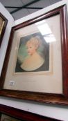 A framed and glazed Raphael Tuck print of a young girl, after Ernest Breun