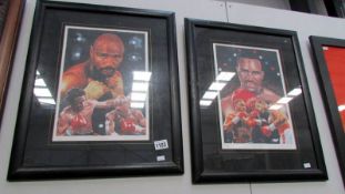A pair of framed and glazed boxer prints being Marvin Hagler and Evander Holfield, images 24 x 34cm