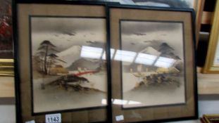 A pair of framed and glazed Japanese paintings with mount Fuji in the background, both signed,