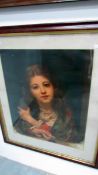 A framed and glazed print of a young girl