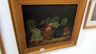 An oil on board fruit on table still life, initialled and dated 1915