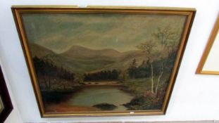 A gilt framed oil on canvas 'River with Mountains in background' signed but indistinct, image 74 x
