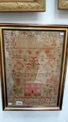 A framed mid 19th century sampler dated 1842, size including frame 15.75'' x 21.5''