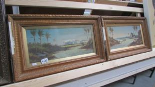 A pair of framed oil on canvas Arabic landscapes signed but indistinct, images 19 x 43 cm