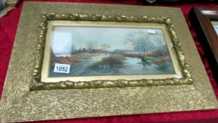 A gilt framed and glazed watercolour country scene