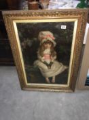 A gilt framed and glazed picture of a young girl sitting