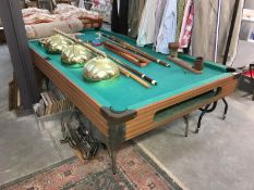 A pool table, cues, lights etc
