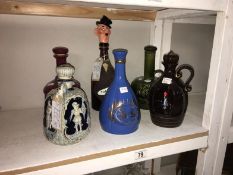5 ceramic & 1 glass decanter including 2 musical