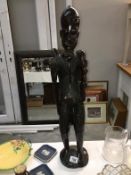 A large carved hard wood African figure