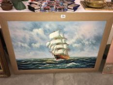 A large framed oil on board of a sailing ship signed Ambrose