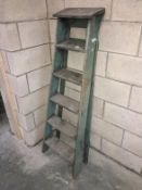 A set of pine steps in original green paint