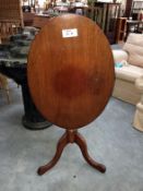 A 19th century mahogany tripod side table by H.