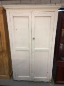 A Victorian painted pine 2 door cabinet