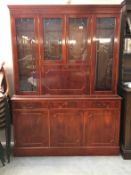 A mahogany drop front free standing cabinet