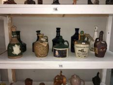 A quantity of ceramic decanters, (some with contents)