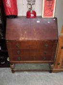 A 1930's oak plywood bureau