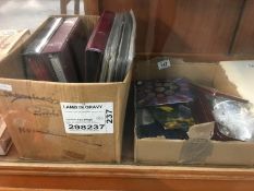 A box of miscellaneous coins & coin display sleeves