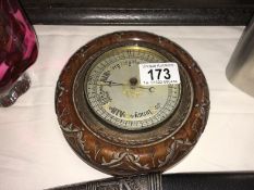 A barometer in round mahogany frame