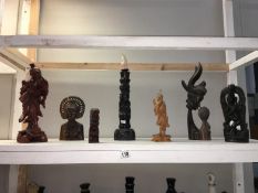 A quantity of carved wood figures