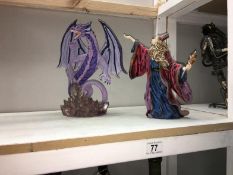 A figure of Merlin & dragon figure