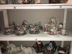 A shelf of part tea sets etc.