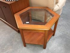 Octagonal glass-topped teak coffee table