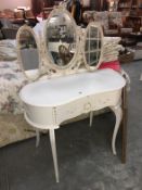 A triple mirrored dressing table