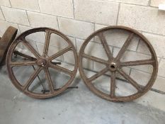 A pair of large metal wheels