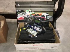 A box of Scalextric track, a framed print of a Nimrod, a Formula 1 picture & a formula 1 model