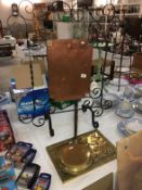 A wrought iron and hammered copper fire screen, brass warming pan and plaque