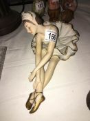 A bisque figurine of a ballet dancer