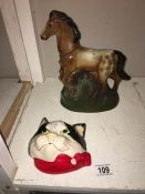 A novelty Apaloosa horse whisky bottle and a cats head string holder