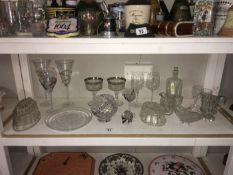 A quantity of glassware including paperweights,