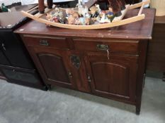 An Art Nouveau mahogany sideboard