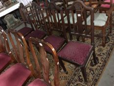 A set of 4 Edwardian mahogany dining chairs with wheatsheaf carvings on padfoot feet