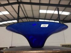 A large blue art glass bowl