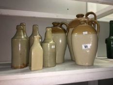 A quantity of stoneware beer bottles and flagons