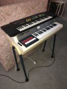 A Bontempi organ on stand and 1 other
