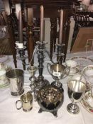 A quantity of silverplate including candelabra, trophies,