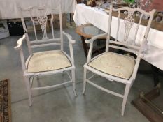 A pair of shabby chic painted elbow chairs