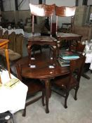 A mahogany dining table and 6 chairs with brass inlay