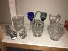 A collection of glassware including ice buckets,