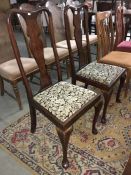 A pair of Edwardian high back dining chairs on Queen Anne legs