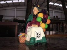 A Royal Doulton balloon seller figurine