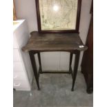 A small dark wood hall table