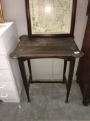 A small dark wood hall table